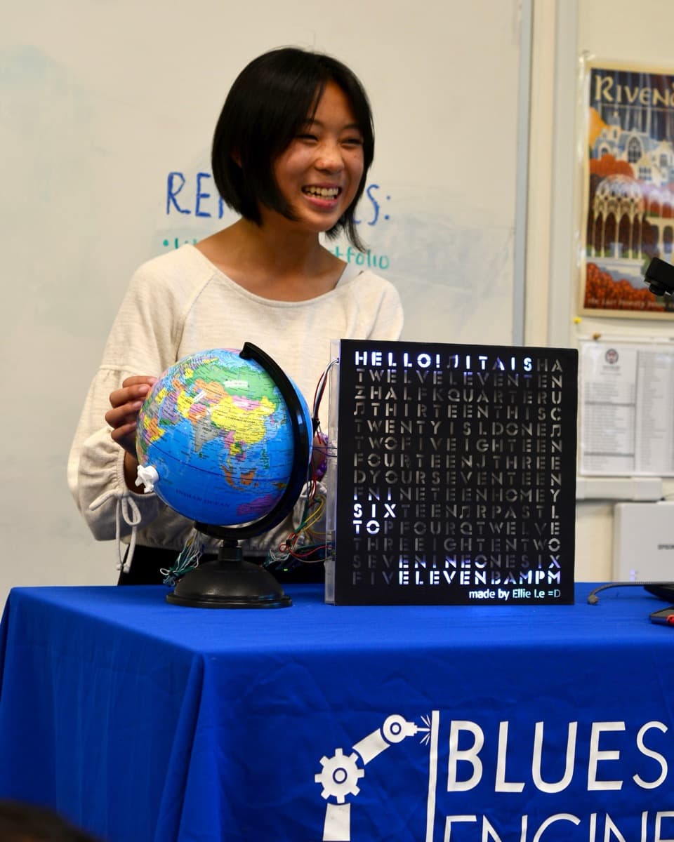 Ellie L. with their project, Time-Zone-Alterable Word Clock